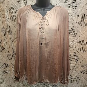 Jennifer Lopez flowy light tan top. Lace up in front with tie.